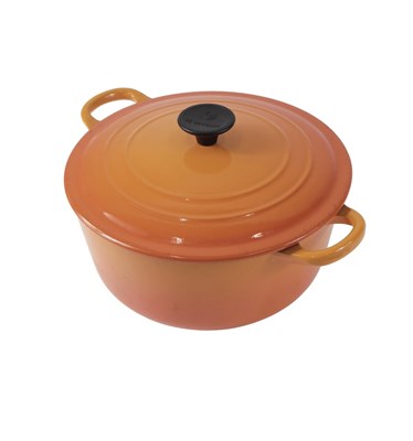 Lot 201 - A Le Creuset orange casserole dish, 23cm...