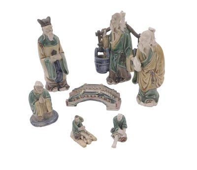 Lot 488 - A group of Oriental pottery figures,...
