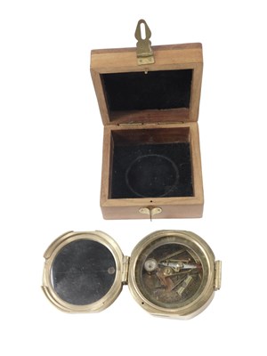 Lot 215 - A modern brass cased compass, in a teak...