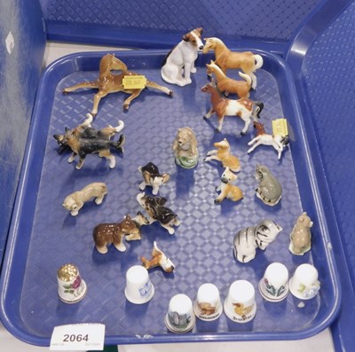 Lot 2064 - A collection of ceramic animal figures, to...