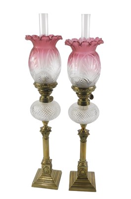 Lot 110 - A pair of Victorian oil lamps, each with a...