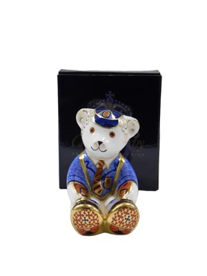 Lot 590 - A Royal Crown Derby teddy bear school boy...