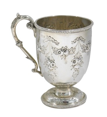 Lot 661 - A Victorian silver cup, with embossed and...