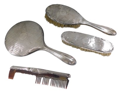 Lot 664 - A silver backed four piece dressing table set,...