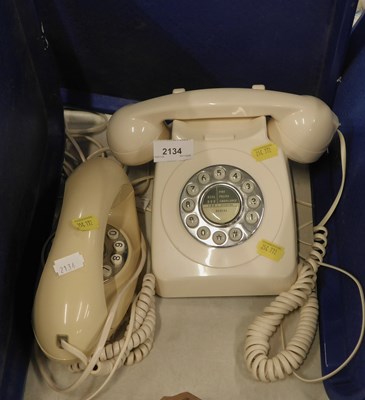 Lot 2134 - Two cream coloured retro telephones.