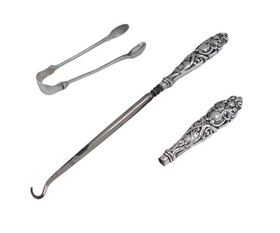 Lot 677 - A pair of George V silver sugar tongs,...