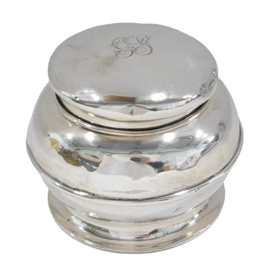 Lot 687 - A silver tobacco jar, of hammered design...
