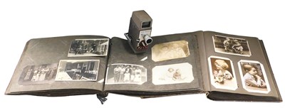 Lot 630 - Two 1920s and later postcard albums, to...