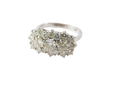 Lot 87 - A diamond cluster ring, the central diamond...