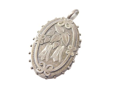 Lot 92 - An Edwardian silver locket, with beaded outer...