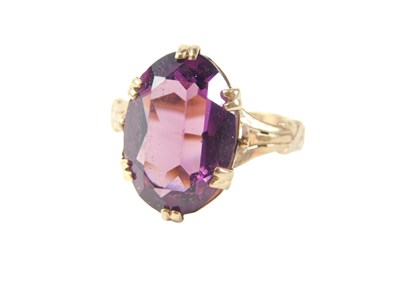 Lot 97 - A single stone dress ring, the oval amethyst...