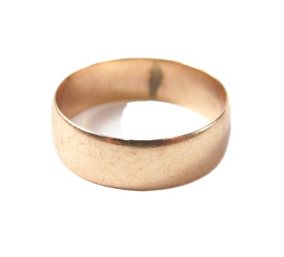 Lot 33 - A 9ct rose gold wedding band, 6mm...