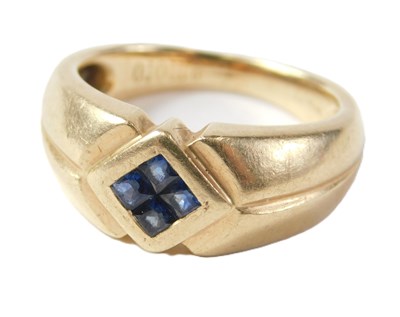 Lot 35 - A sapphire dress ring, set with four square...