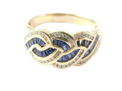 Lot 37 - A sapphire and diamond dress ring, the waved...