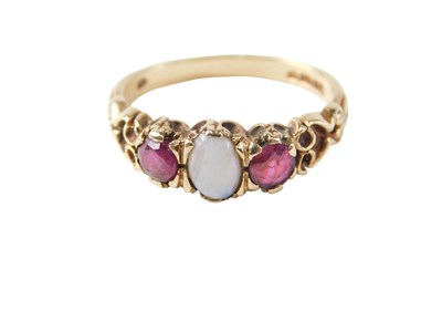 Lot 99 - A 9ct gold dress ring, set with two garnets...