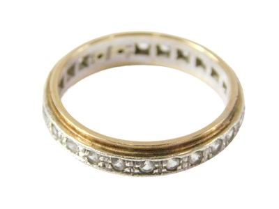 Lot 512 - A 9ct white gold eternity ring, of bicolour...
