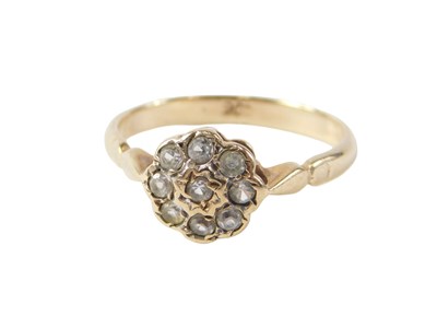 Lot 513 - A cluster ring, set with tiny diamonds each...
