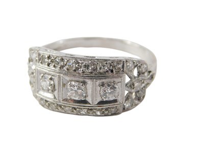 Lot 517 - A diamond dress ring, set with three round...