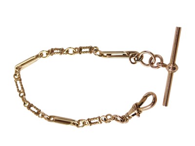 Lot 519 - A rose gold watch chain, with T bar and clip,...