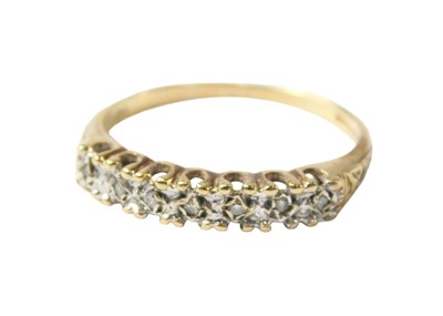 Lot 718 - A 9ct gold diamond half hoop dress ring, set...