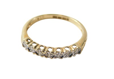 Lot 719 - A 9ct gold half hoop dress ring, set with tiny...