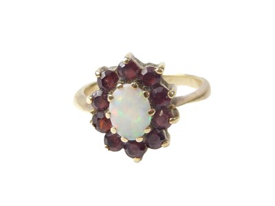 Lot 549 - A 9ct gold cluster ring, set with oval opal,...