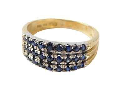 Lot 541 - An 18ct gold pave set sapphire dress...