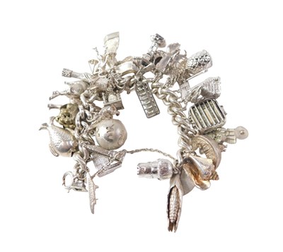 Lot 537 - A silver curb link charm bracelet, and an...
