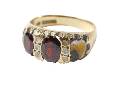 Lot 75 - A 9ct gold gypsy ring, set with three garnets...