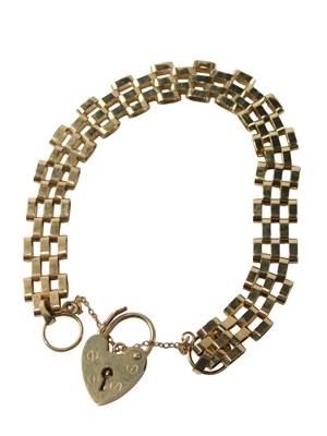 Lot 729 - A 9ct gold bracelet, with textured strap and...