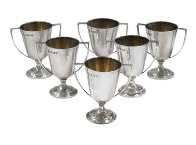 Lot 738 - A George V cased set of six silver egg cups,...