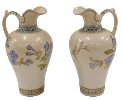 Lot 796 - A pair of Doulton Lambeth ewers, each on a...