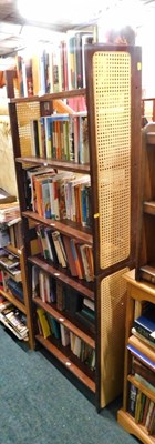 Lot 1668 - Two hardwood framed bookcases, each with caned...