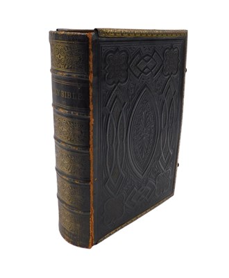 Lot 802 - A 19thC family bible, coloured edition by...