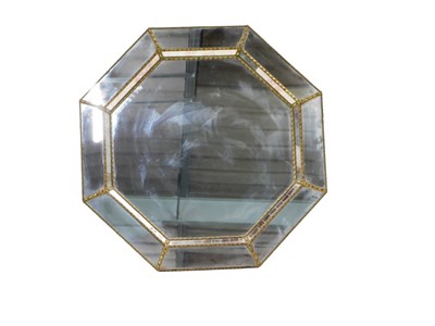 Lot 819 - An octagonal wall mirror, of panelled design,...