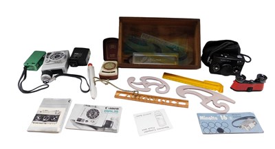 Lot 758 - A group of cameras, comprising a Rollei 35S,...