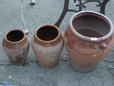 Lot 1635 - Three terracotta jars. (AF)