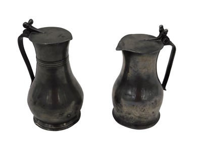Lot 381 - Two French lidded jugs, each with acorn knop...