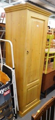Lot 1504 - A single pine wardrobe, 189cm high, 61cm wide,...