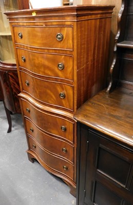 Lot 1525 - A reprodux walnut chest on chest, with three...