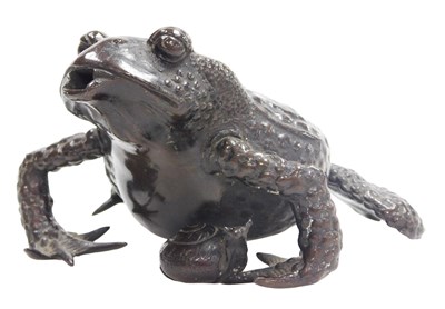 Lot 23 - A Japanese bronze figure of a toad, modeled...
