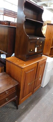 Lot 1555 - An Ercol dark elm side cabinet, with upper...