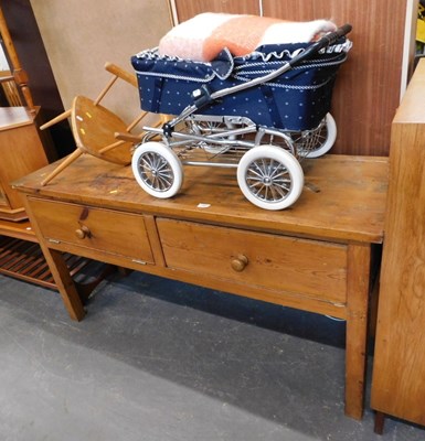 Lot 1561 - A rustic pine kitchen table, with two fall...