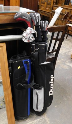 Lot 1679 - A Dunlop golfing bag, containing various golf...