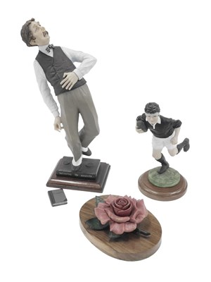 Lot 867 - Three collectable figures, comprising a resin...