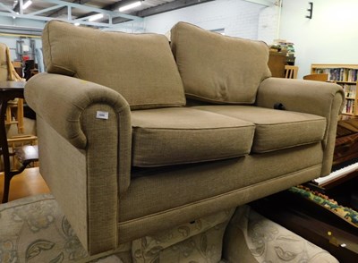 Lot 1698 - A tan upholstered two seater settee, high back...