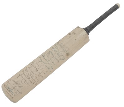 Lot 869 - A miniature cricket bat, signed by various...