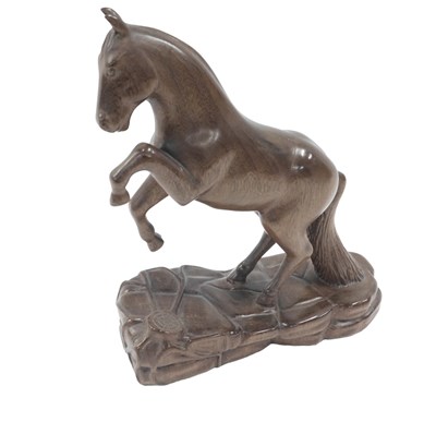 Lot 870 - An Oriental carving of a rearing horse, 33cm...