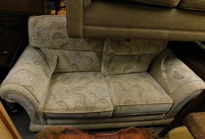 Lot 1699 - A three seater tan settee.