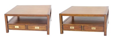 Lot 1061 - A pair of mahogany coffee tables, each with a...